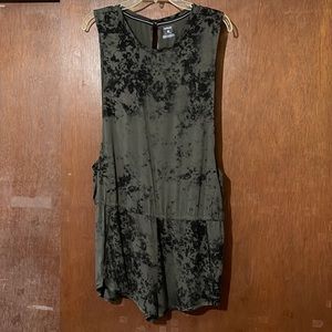 Summer romper with pocket.  Loose fit with peek a boo back.  Never worn.